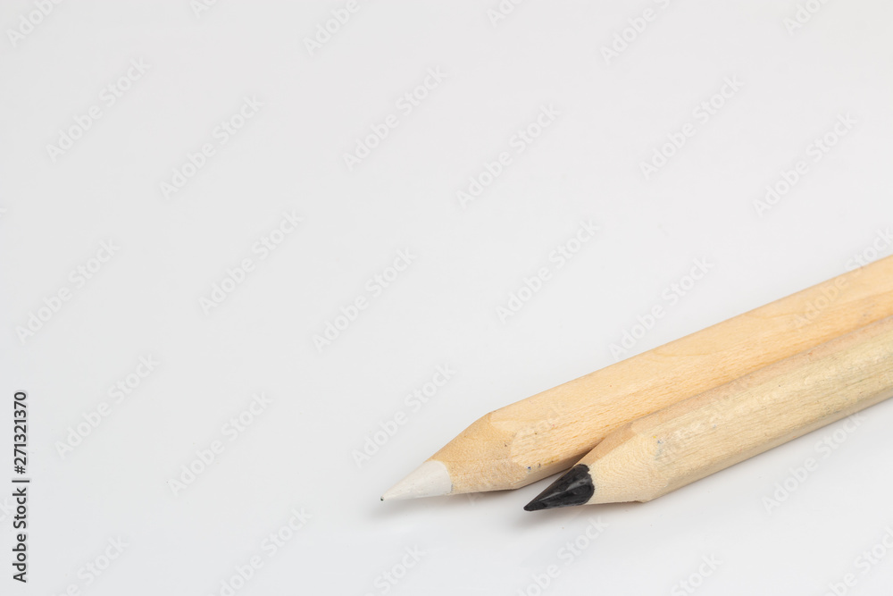 White and black pencils on white background White and black pencils on white background