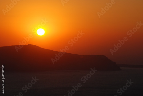 The volcano of Fira at Sunset as seen from the Santorini Island © Dimitris