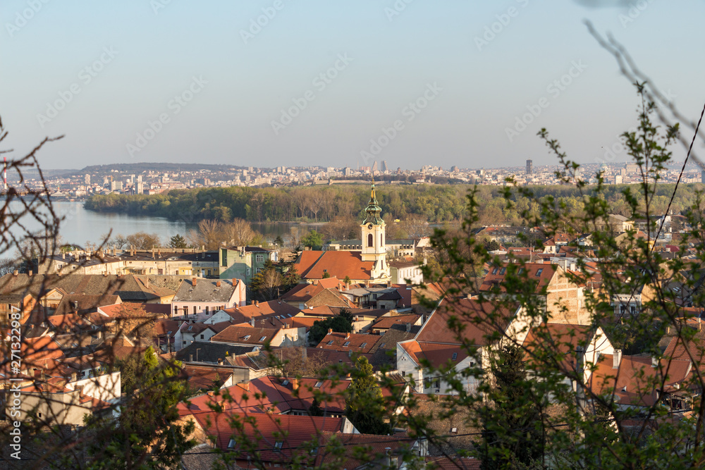 Beautiful panoramic view over Zemun municipality rooftops, a church and Danube river. Belgrade, Serbia.