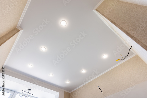 Stretch ceiling in the kitchen with installed and included spotlights