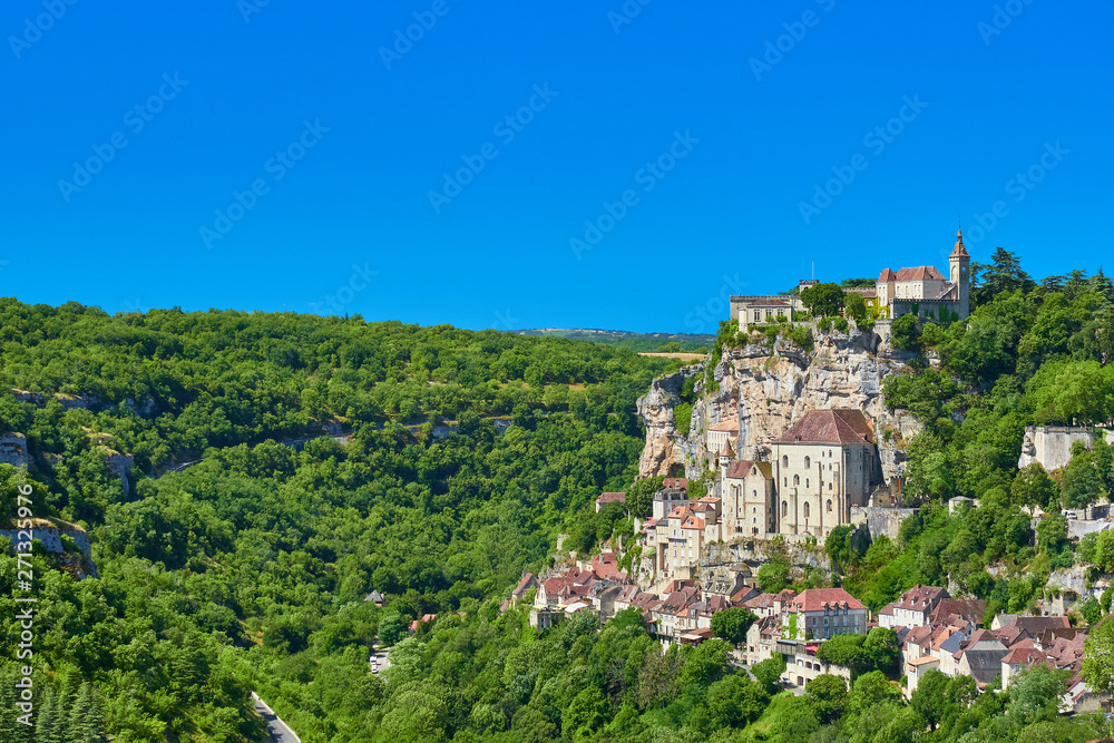 Landscape view of the Dordogne tributary river valley cliff with the medieval french village of Rocamadour on one side, Lot Department, Quercy, Occitanie Region, France. UNESCO world heritage site.