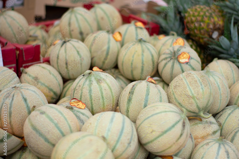 Pile of Charentais Melons in market