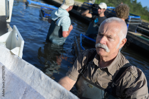 senior man working in a lake