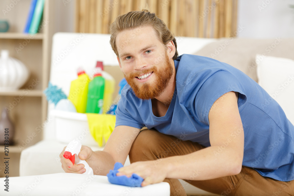 smiling young cleaning company worker smiling young cleaning company worker