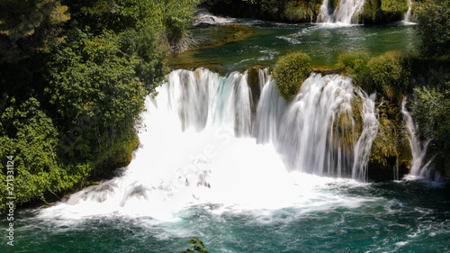 Close view to the waterfall in the mountain lake in the national park of Croatia in summer