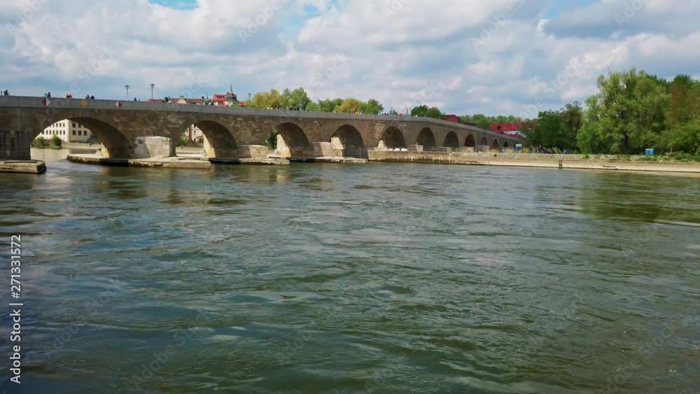 Medieval stone bridge of Regensburg, Germany in spring sunny day. Medieval stone bridge of Regensburg, Germany in spring sunny day.