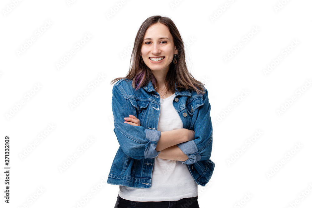 Cheerful young woman standing over white background with crossed arms Cheerful young woman standing over white background with crossed arms