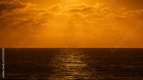 Beatiful sunset above the mediterranean sea. Sunrise with red and orange skies and the sun shining over the ocean