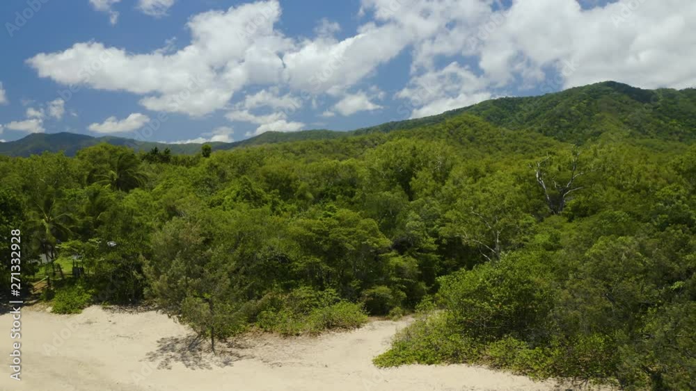 Aerial, beautiful view on tropical vegetation and hills on australian coast and Clifton Beach in Cairns, Queensland Aerial, beautiful view on tropical vegetation and hills on australian coast and Clifton Beach in Cairns, Queensland