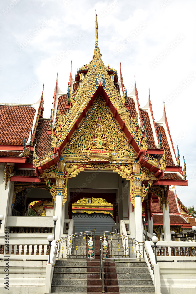 Architectural detail from exterior view of the Buddhist temple in Damnoen Saduak Floating Market near Bangkok, Thailand