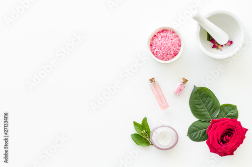 Natural organic cosmetics with rose extract on white background top view copyspace