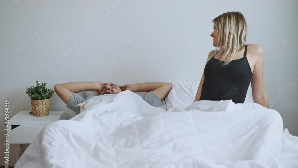 Couple lover wake up happy on white bed in the morning