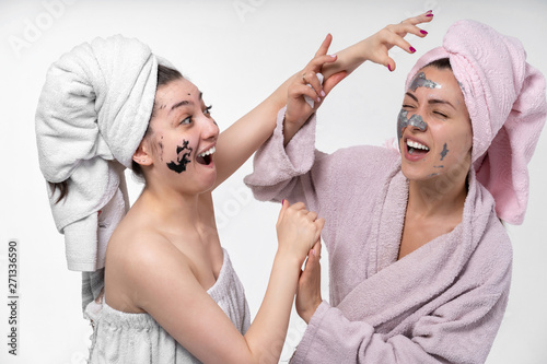 girls have a great time together and make facial skin care treatments. Actively communicate and have fun. Europeans 30 years old
