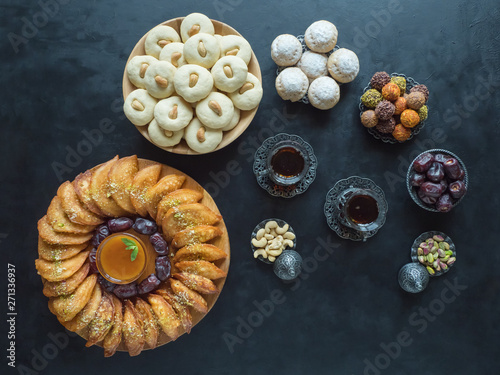 Ramadan food background. Arabic sweets. Arabian Qatayef, Ghorayeba sweets and Egyptian cookies 