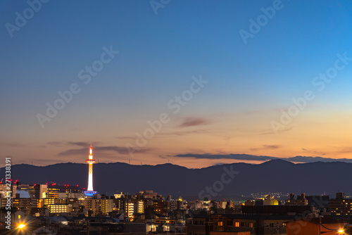 Colorful Kyoto Tower with Kyoto city skyline view at dusk in Japan