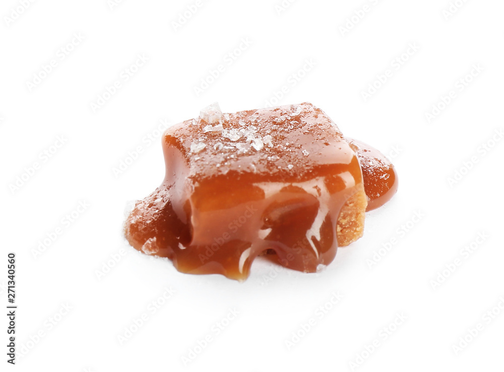 Delicious candy with caramel sauce and salt on white background Delicious candy with caramel sauce and salt on white background