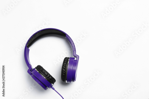 Stylish modern headphones on white background, top view