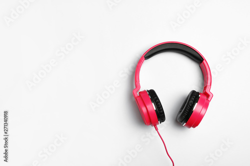 Stylish modern headphones on white background, top view