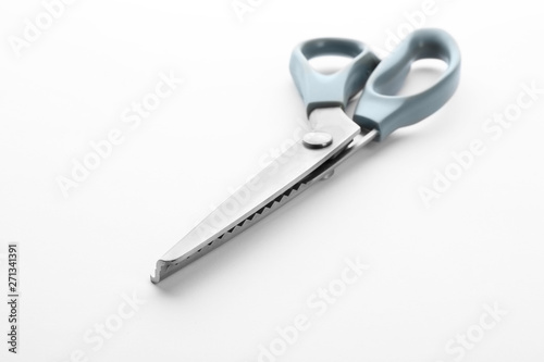 Pair of sewing scissors on white background © New Africa
