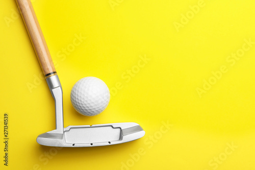 Golf ball and club on color background, flat lay. Space for text