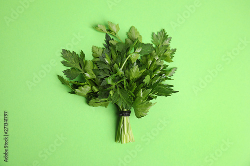 Bunch of fresh green parsley on color background, view from above