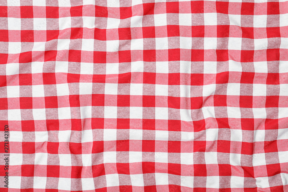 Checkered picnic tablecloth as background, top view