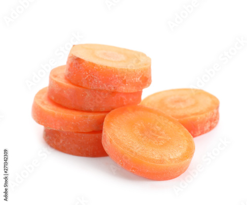 Slices of fresh ripe carrot on white background