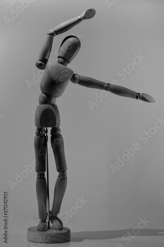 wooden mannequin man with gun