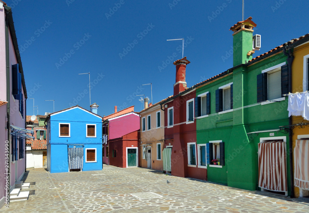 A backyard with colorful houses in Burano Island, Venice, Italy.