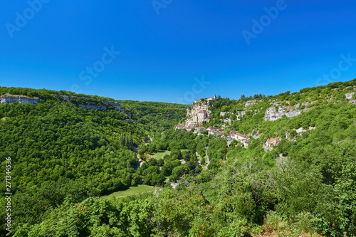 Landscape view of the Dordogne tributary river valley with the medieval french village of Rocamadour built on the cliff, Lot Department, Quercy, Occitanie Region, France. UNESCO world heritage site.