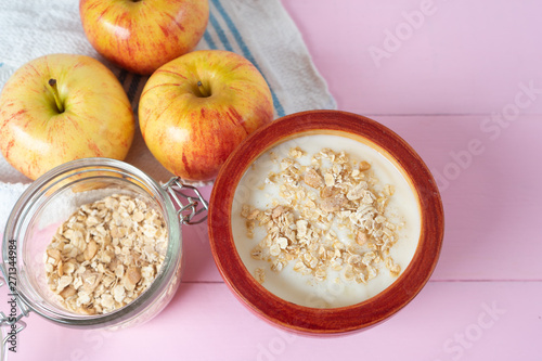 Healthy breakfast with apple yogurt and oat © Guajillo studio
