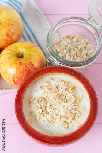 Healthy breakfast with apple yogurt and oat