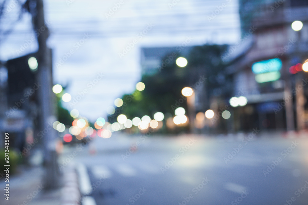 Fototapeta premium defocused night city life: cars, people and street lamps, retro style