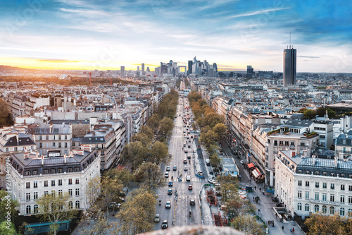Champs-Elysees and La Defense Financial District Paris France at sunset. Modern vs. Old architecture. Blue sky. © Augustin Lazaroiu