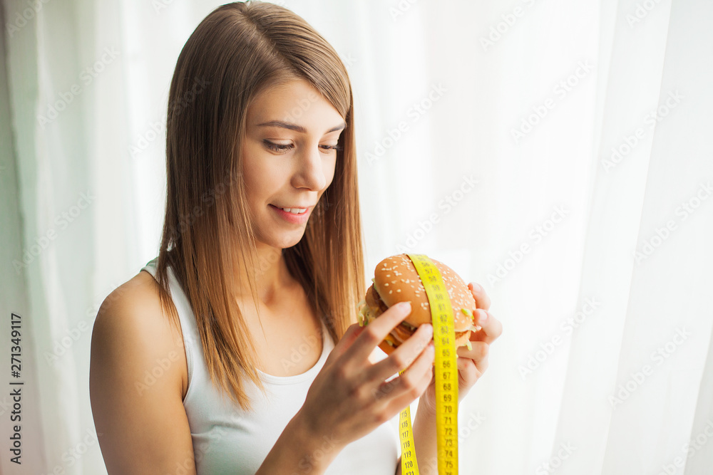 Diet. Young woman preventing her to eat junk food. Healthy eating concept Diet. Young woman preventing her to eat junk food. Healthy eating concept