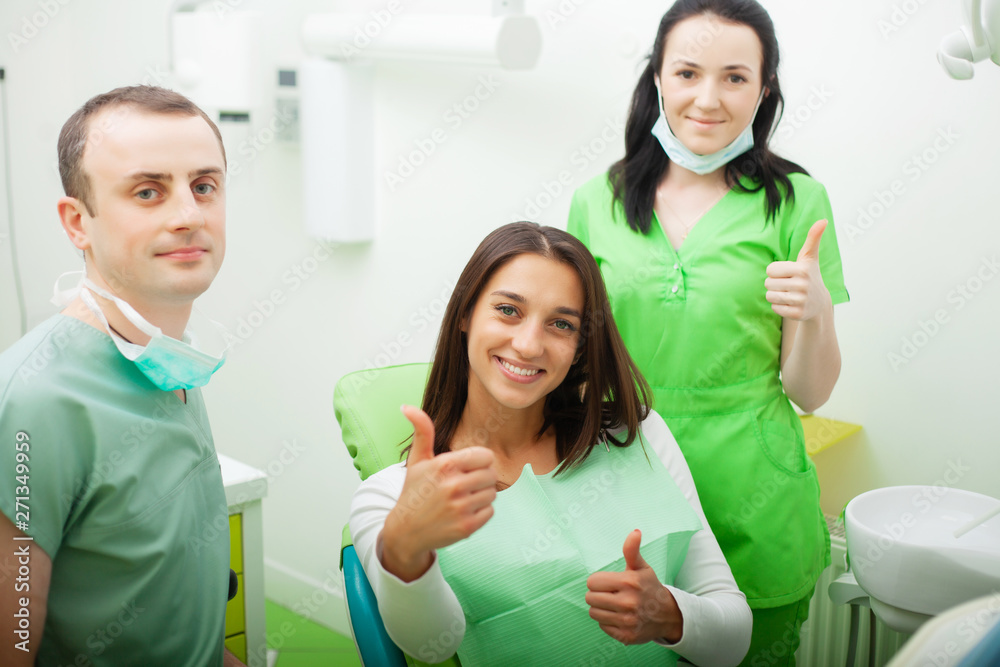 Fototapeta premium Patient in dentistry. Pretty woman visiting her dentist in clinic