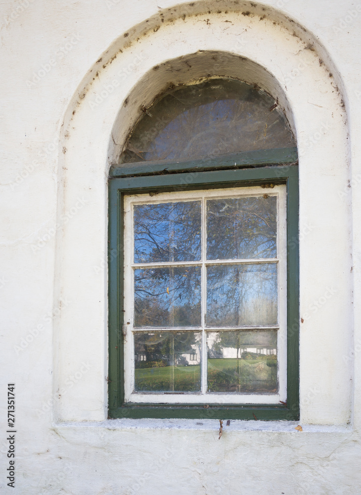 old arch window and reflections