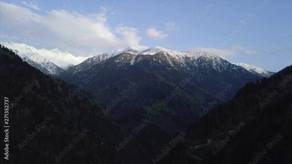 Aerial view of snowy mountain / Peak of the mountain and cloudy sky Aerial view of snowy mountain / Peak of the mountain and cloudy sky