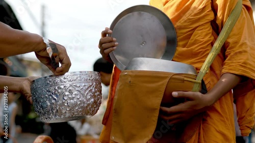 offering food to thai monk early morning