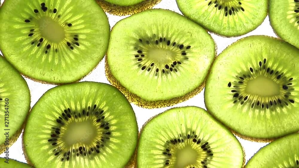 Full Frame Slices Of Kiwis Rotate Through Frame Full Frame Slices Of Kiwis Rotate Through Frame