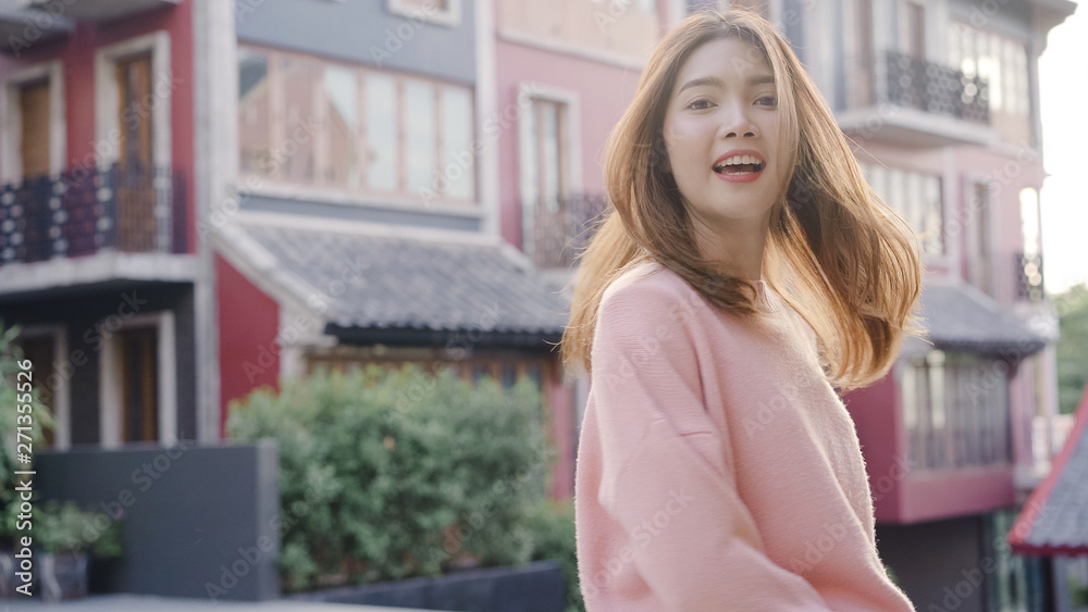 Attractive Asian tourist woman feeling happy traveling in Beijing, China, cheerful beautiful young teenager blogger female walking at Chinatown. Lifestyle backpack tourist travel holiday concept. Attractive Asian tourist woman feeling happy traveling in Beijing, China, cheerful beautiful young teenager blogger female walking at Chinatown. Lifestyle backpack tourist travel holiday concept.