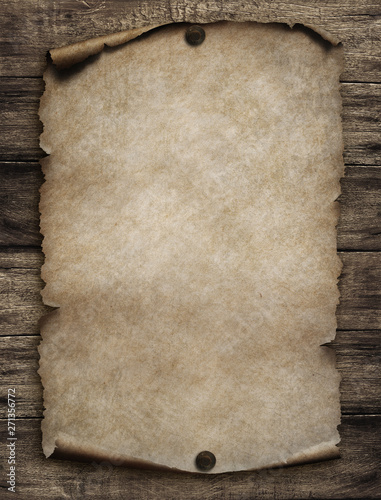 Old paper scroll on wood wa...