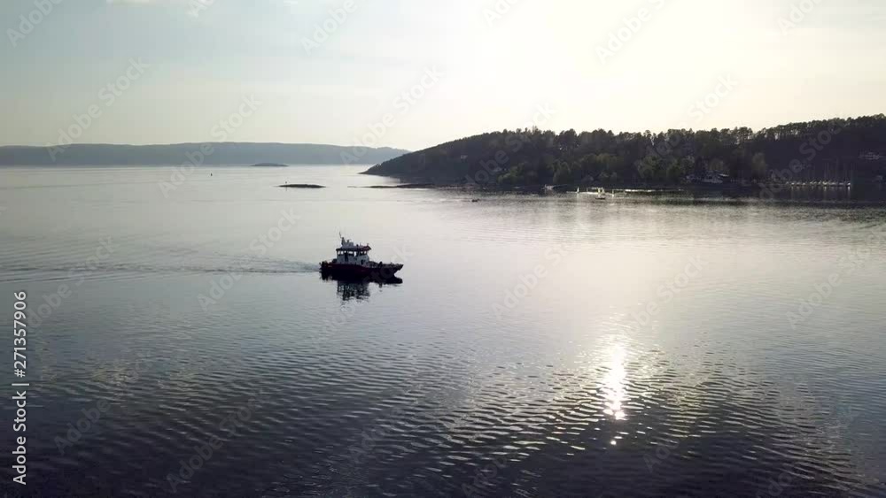 Rotating Drone Shot of a coastguard boat at Nordstrand Bad in Oslo, Norway.mp4 Rotating Drone Shot of a coastguard boat at Nordstrand Bad in Oslo, Norway.mp4