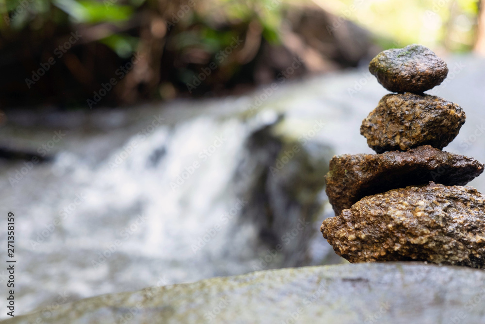 Four stones are arranged vertically and have flowing through the forest. Four stones are arranged vertically and have flowing through the forest.