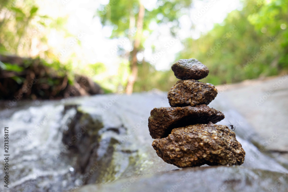 Four stones are arranged vertically and have flowing through the forest. Four stones are arranged vertically and have flowing through the forest.