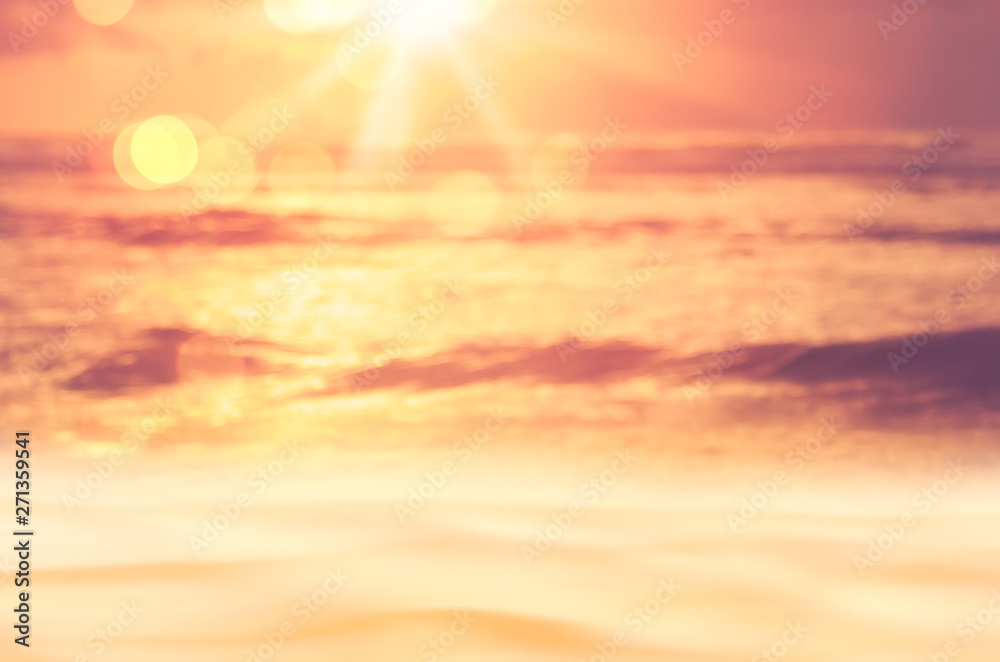 Summer vacation and travel adventure concept. Blur tropical sunset beach with bokeh sunlight wave abstract background.