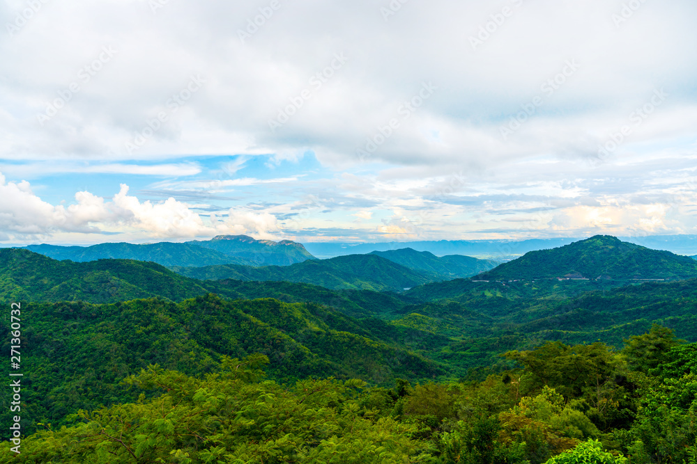 Blue sky high peak mountains fog hills mist scenery national park views at Phu Tub Berk, Khao Koh, Phetchabun Province, Thailand