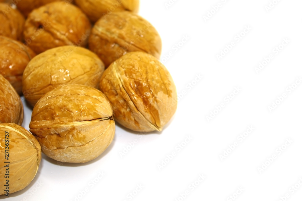On a white background close-up washed with water walnut On a white background close-up washed with water walnut