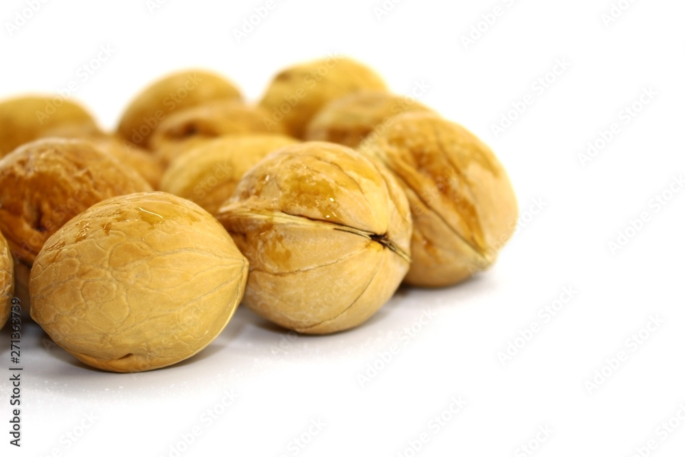 Raw walnut close-up on white background Raw walnut close-up on white background