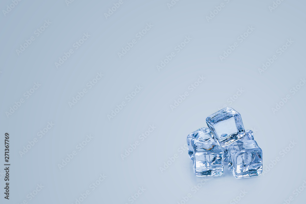Ice cubes isolated over a blue background and copy space Ice cubes isolated over a blue background and copy space